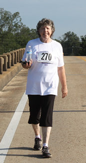 Dorothea walking her Notasulga WIN 3-mile Steps to the Cure walk